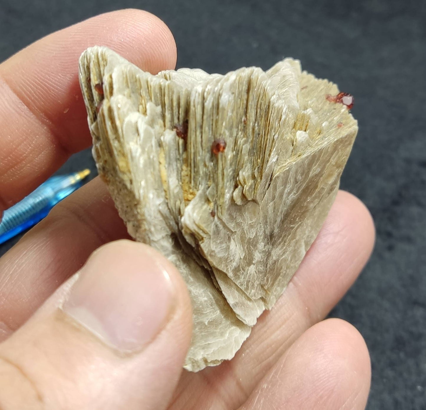 An amazing aesthetic specimen of spessartine garnet embedded in muscovite 56 grams