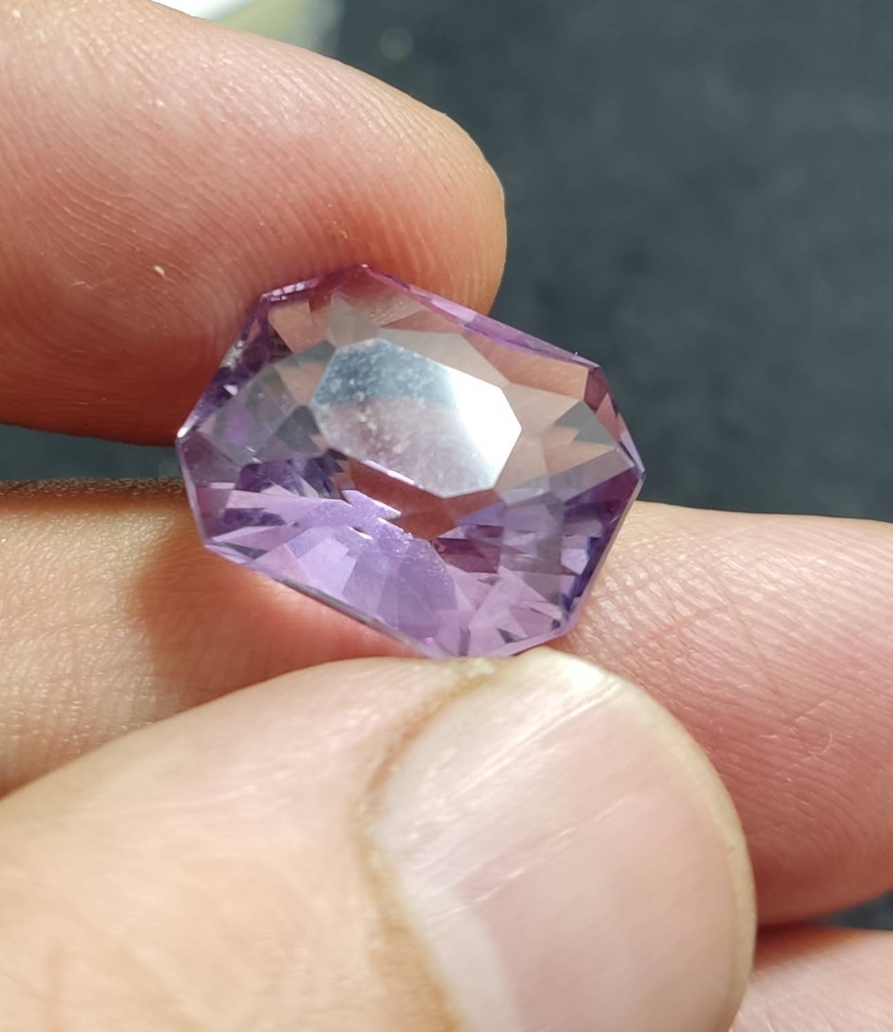 An amazing faceted modified emerald cut amethyst gemstone 13 carats