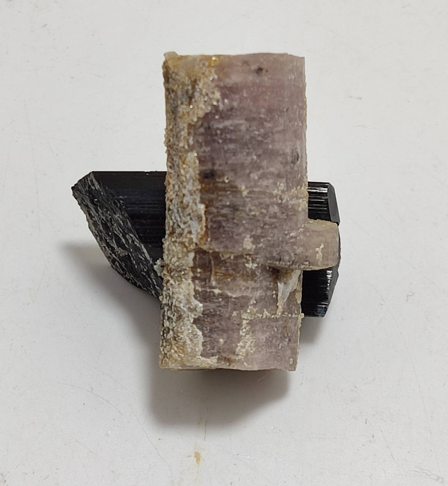 An amazing specimen of fluorescent light purple double terminated Apatite with terminated indicolite cap tourmaline 26.5 grams