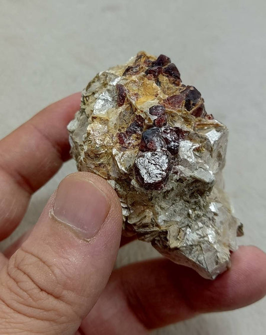An amazing beautiful specimen of spessartine Garnet crystals on matrix with mica 135 grams
