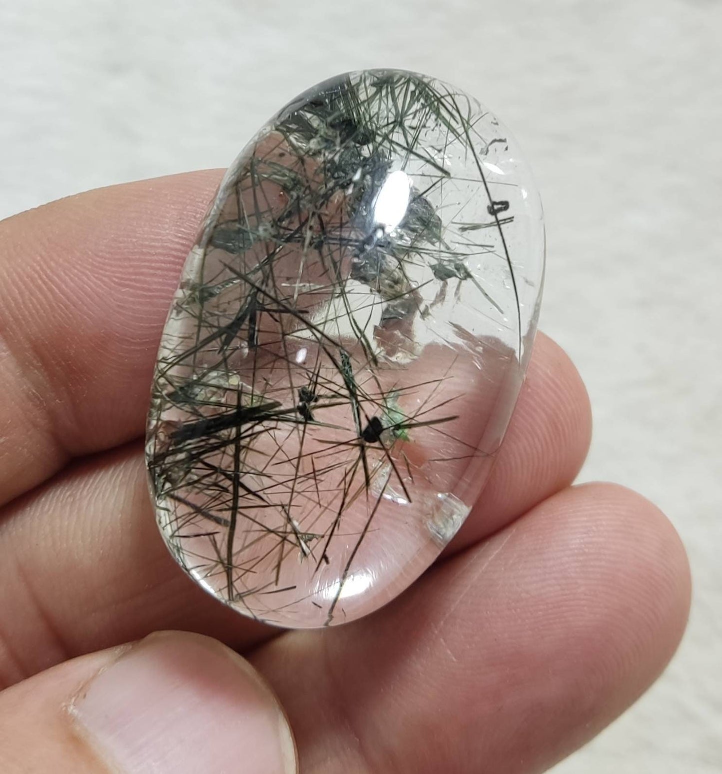 An amazing cabochon of byss-olite  included quartz 128 carats