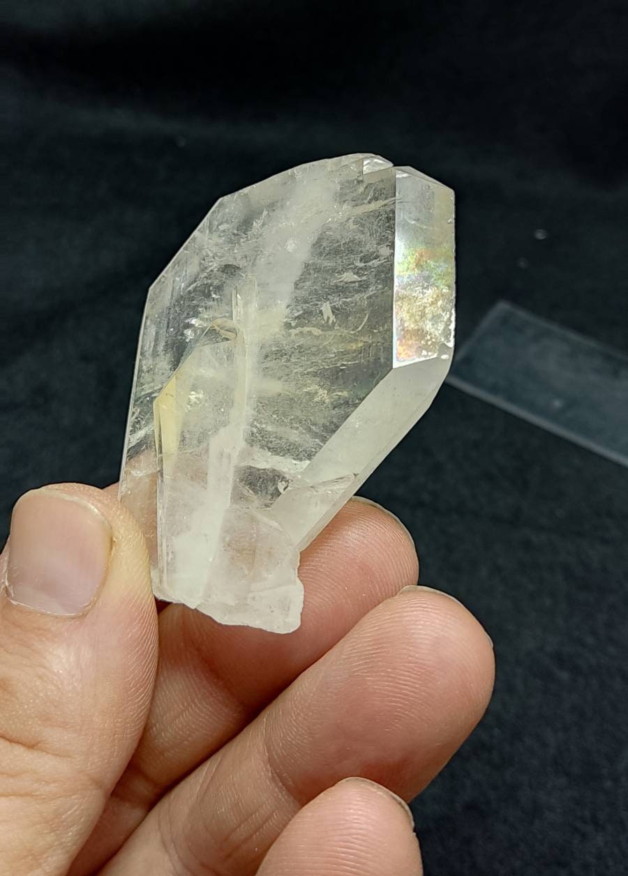 Clear faden quartz crystal with light iron coating 55 grams