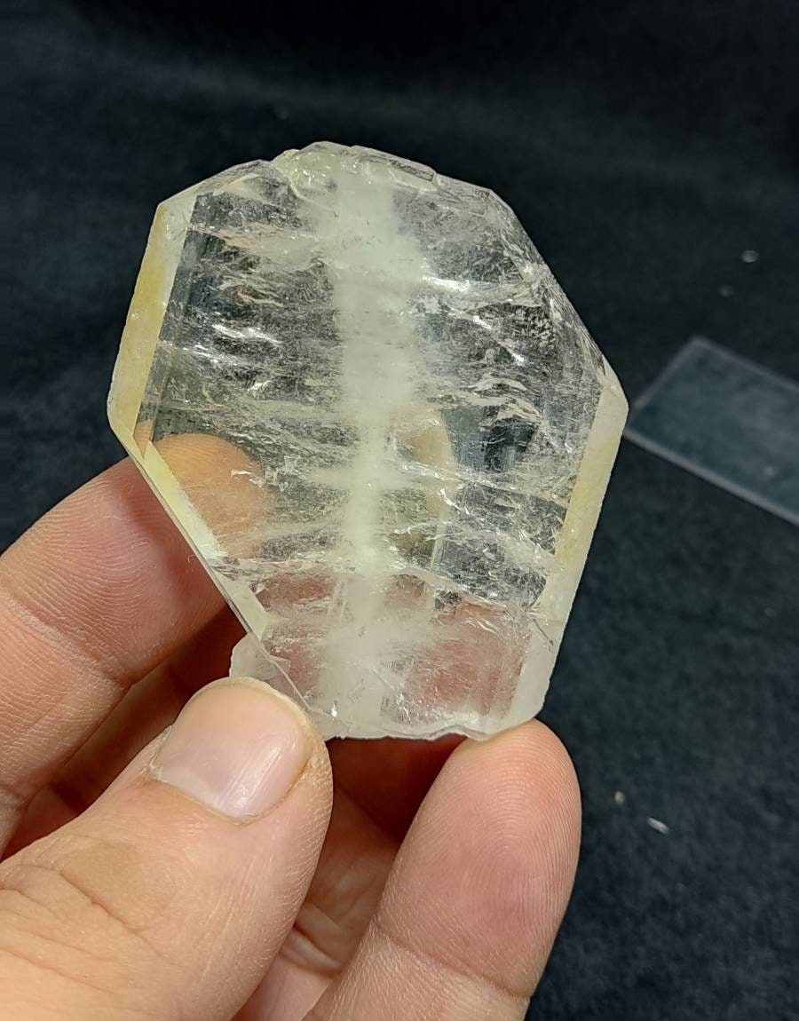 Clear faden quartz crystal with light iron coating 55 grams