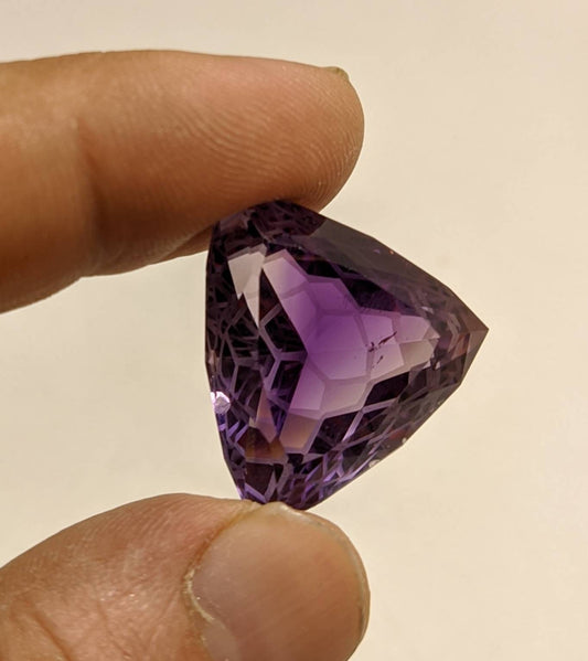 An amazing trillion fancy cut faceted amethyst gemstone 46 carats