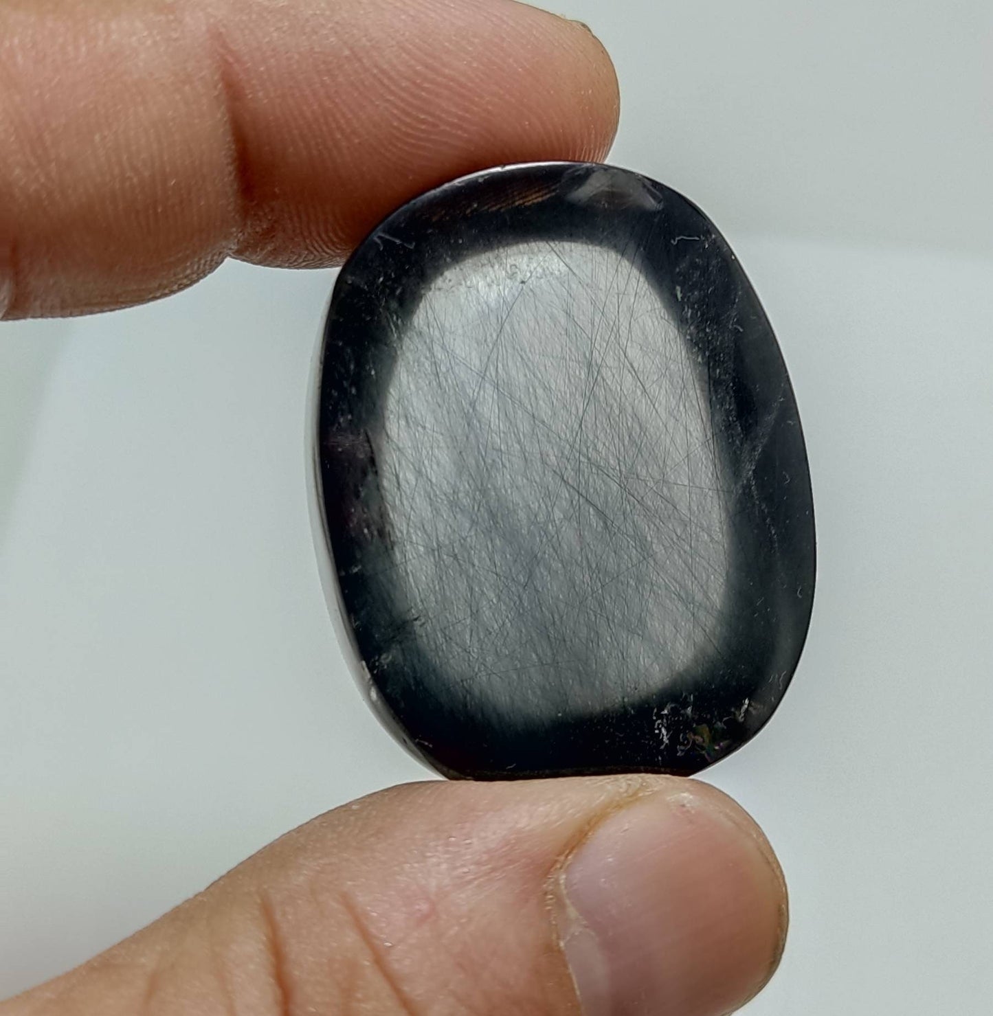 Amazing cabochon of riebe-ckite included quartz 235 carats