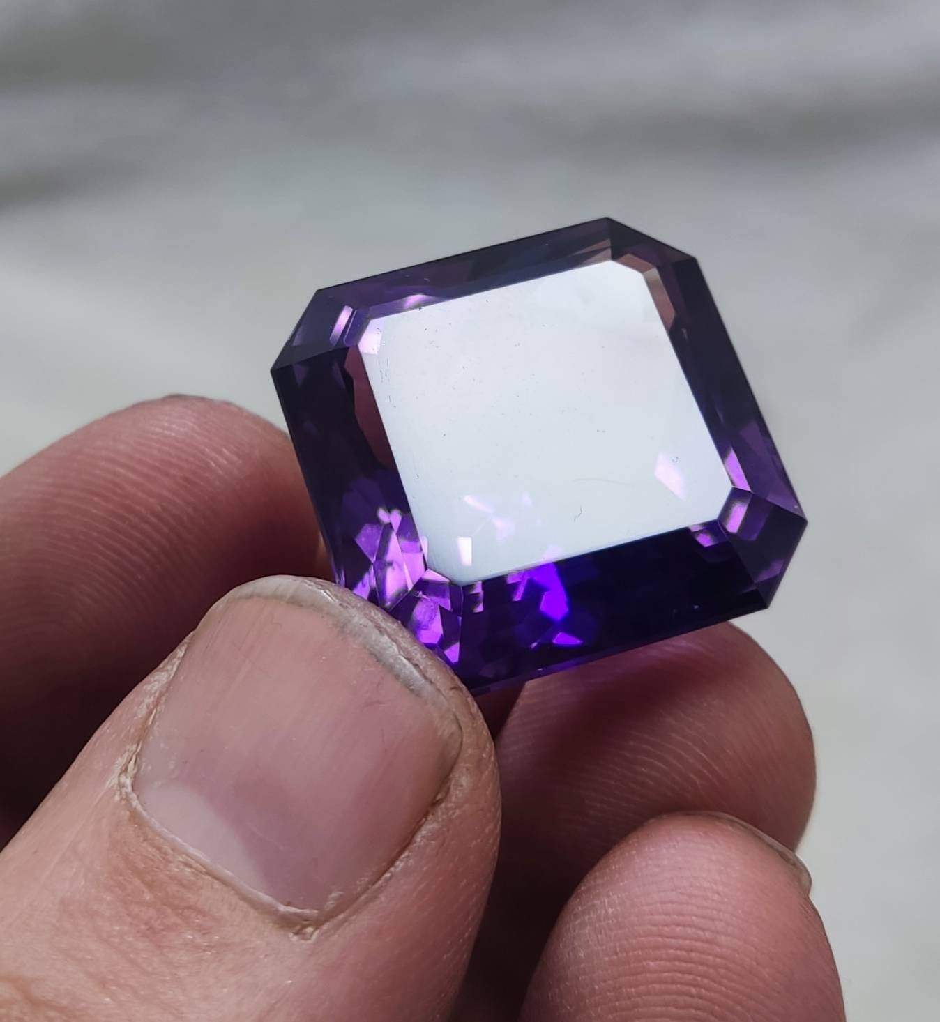 An amazing faceted octagon cut amethyst gemstone 64 carats