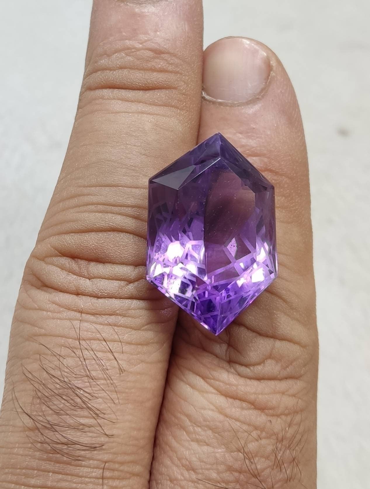 An amazing faceted fancy hexagon cut amethyst gemstone 36 carats