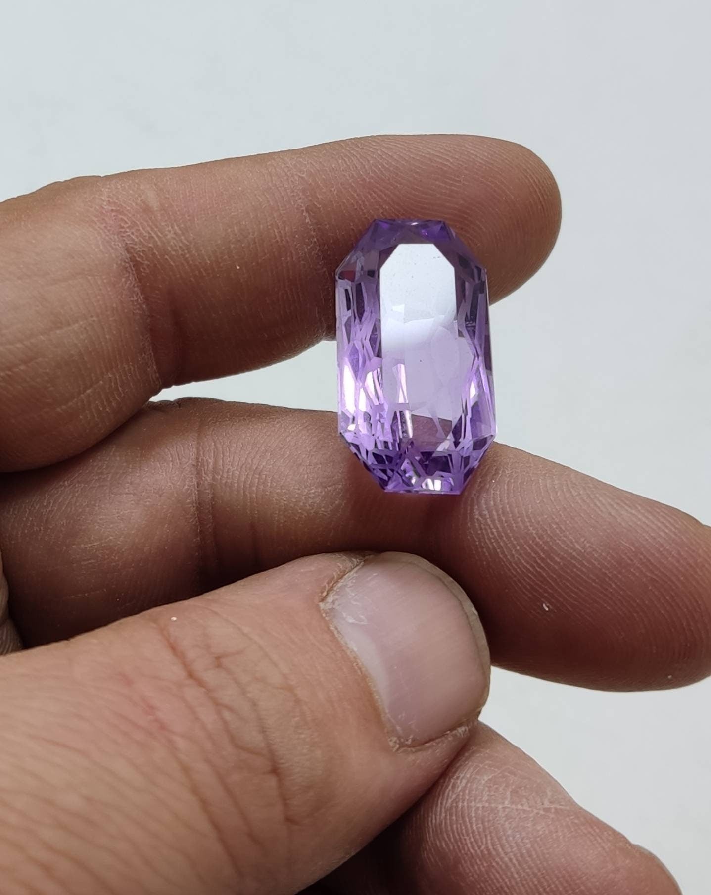 An amazing faceted custom elongated octagon cut amethyst gemstone 23 carats