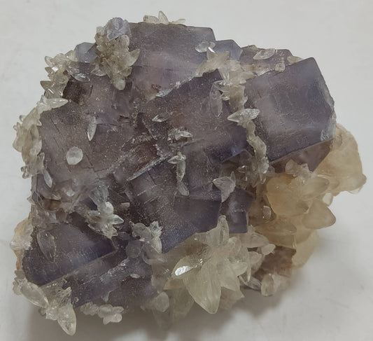 Single natural light purple Fluorite specimen with Calcite on top 270 grams