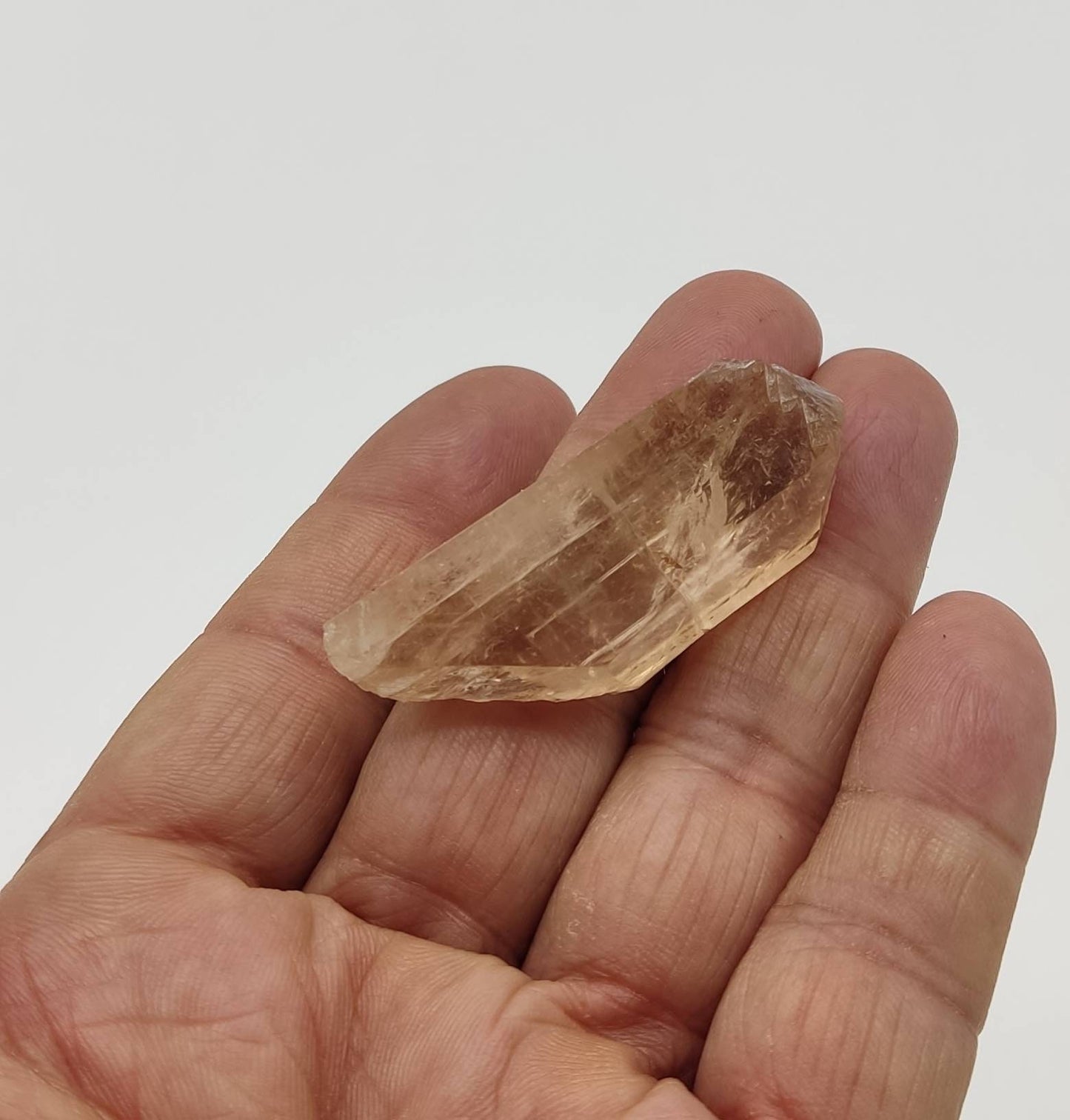Single beautiful terminated gemmy peach color Topaz crystal 32 grams