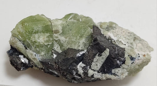 Peridot crystals with magnetite 84 grams