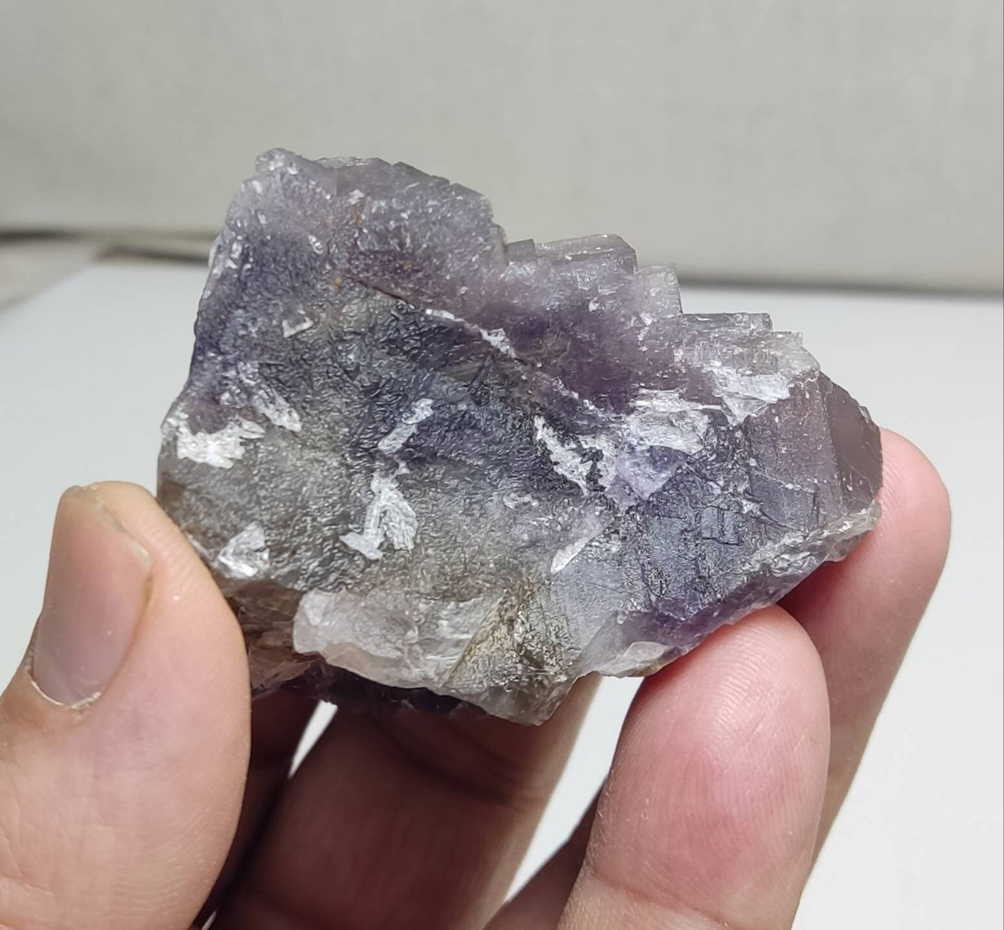 An amazing Single beautiful specimen of grey/purple fluorite with calcite crystals 150 grams