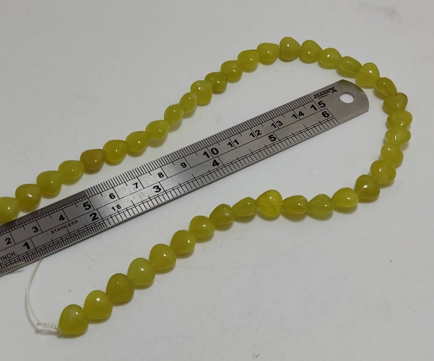 Single High Quality Serpentine drilled beads strand 13-15 inch