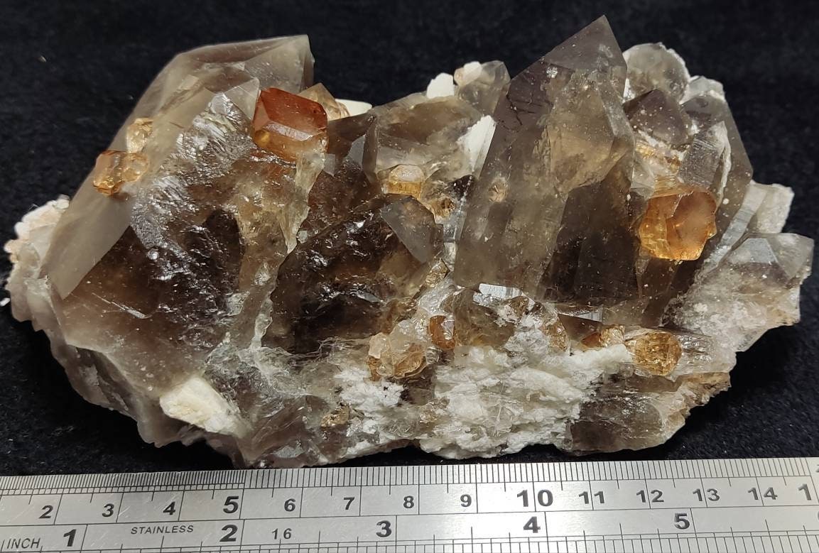 An amazing Specimen of terminated peach color Topaz crystals with quartz on matrix 557 grams