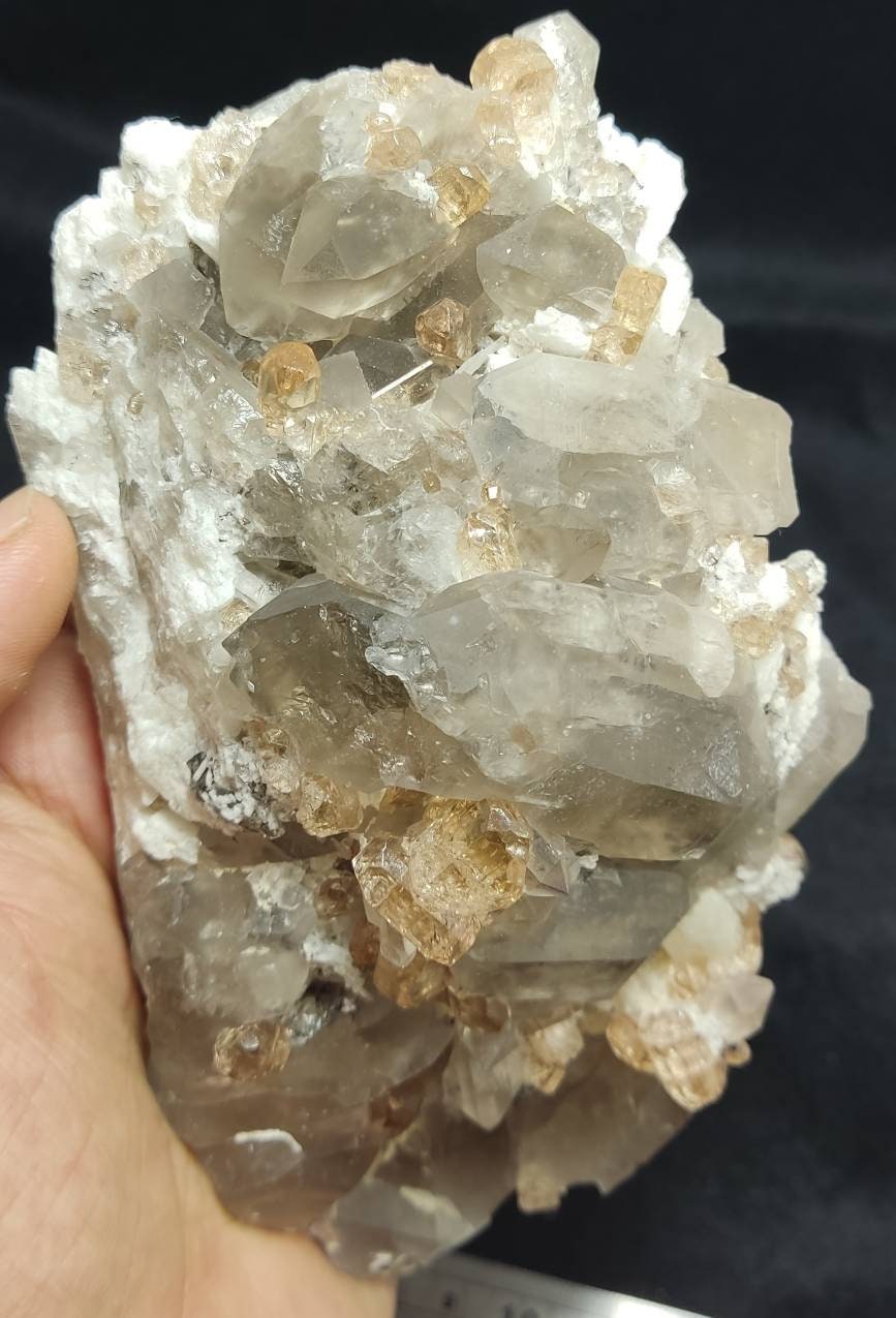 An amazing Specimen of terminated peach color Topaz crystals with quartz on matrix 750 grams