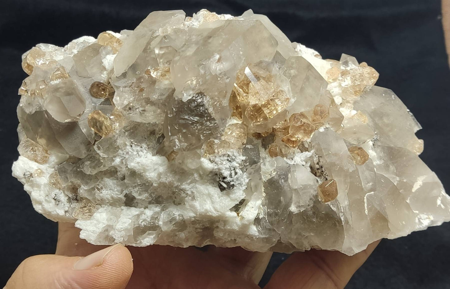 An amazing Specimen of terminated peach color Topaz crystals with quartz on matrix 750 grams