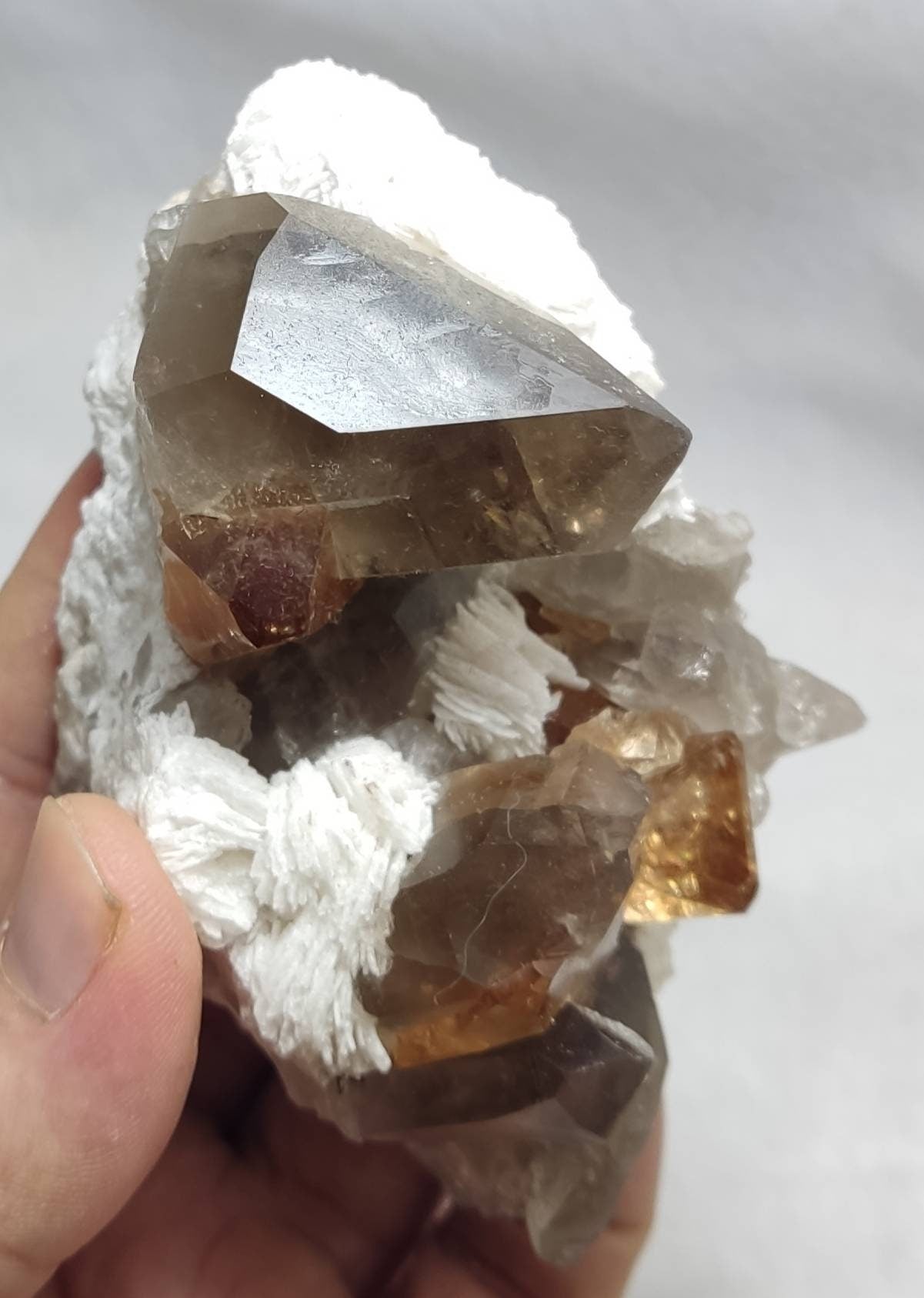 An amazing Specimen of terminated peach color Topaz crystals on matrix 455 grams