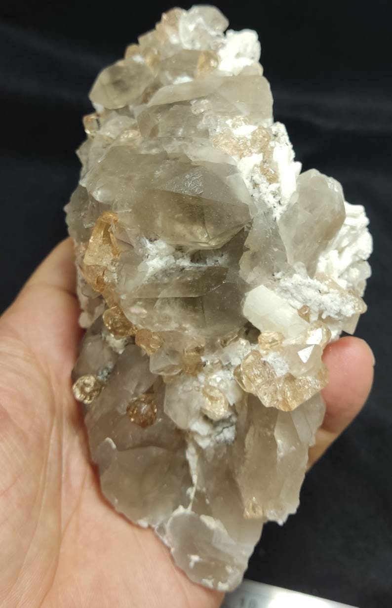 An amazing Specimen of terminated peach color Topaz crystals with quartz on matrix 750 grams