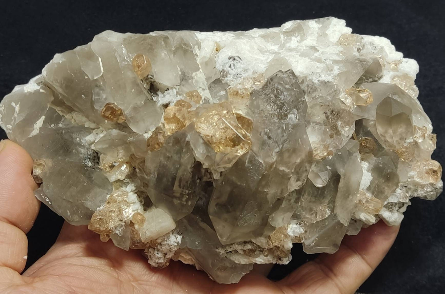 An amazing Specimen of terminated peach color Topaz crystals with quartz on matrix 750 grams