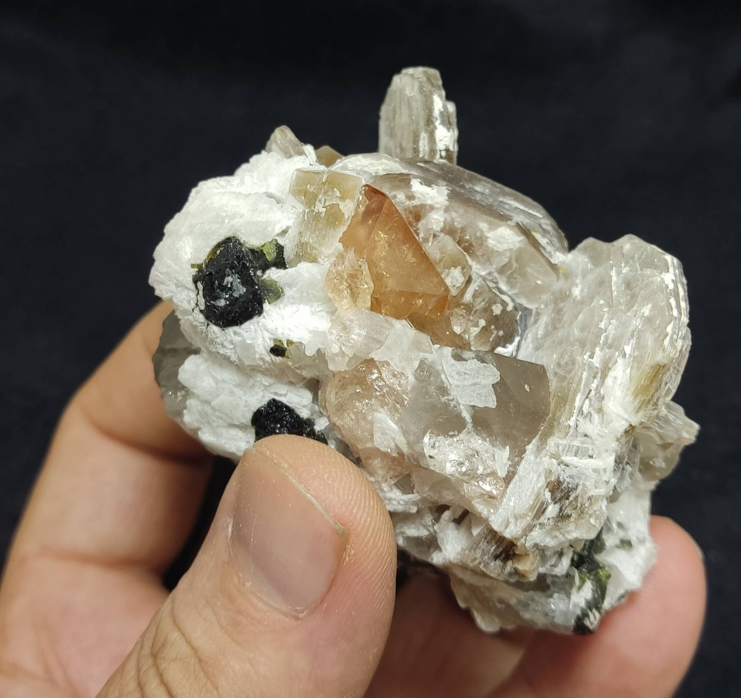 An amazing Specimen of terminated peach color Topaz crystals with quartz and tourmaline 210 grams