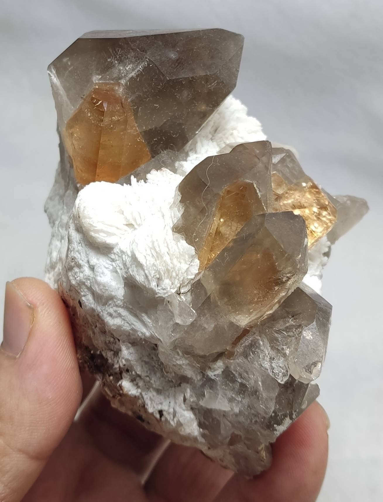 An amazing Specimen of terminated peach color Topaz crystals on matrix 455 grams