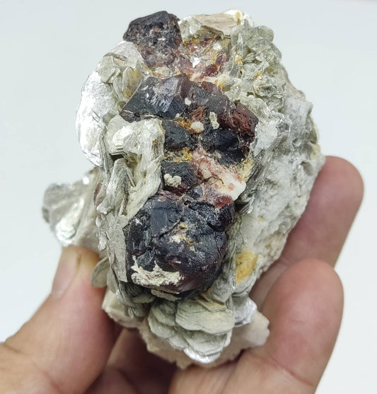 An amazing beautiful specimen of spessartine Garnet crystals on matrix with mica 300 grams