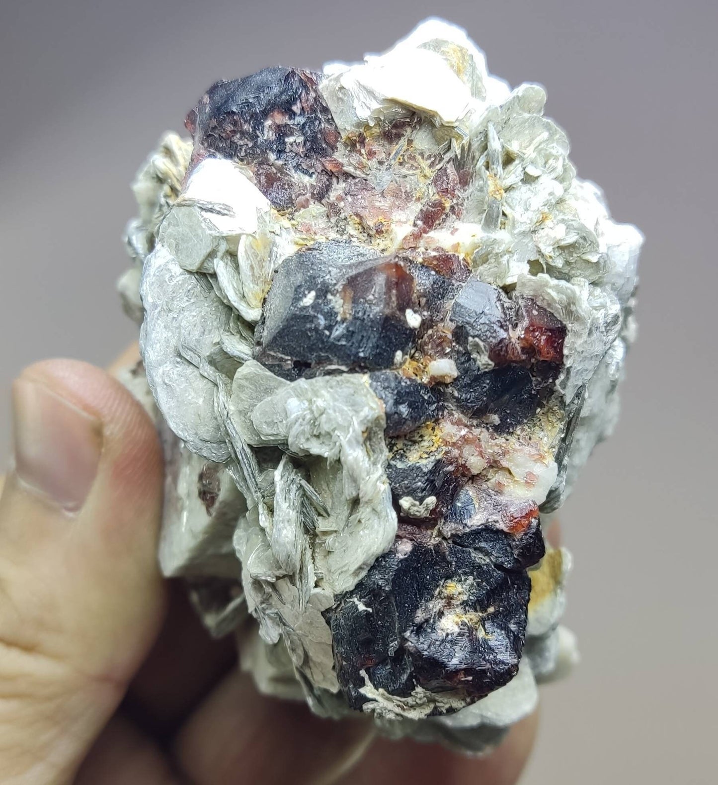 An amazing beautiful specimen of spessartine Garnet crystals on matrix with mica 300 grams
