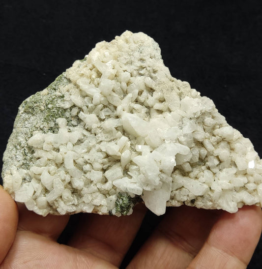 An aesthetic specimen of feldspar Adularia cluster with epidote inclusions 136 grams
