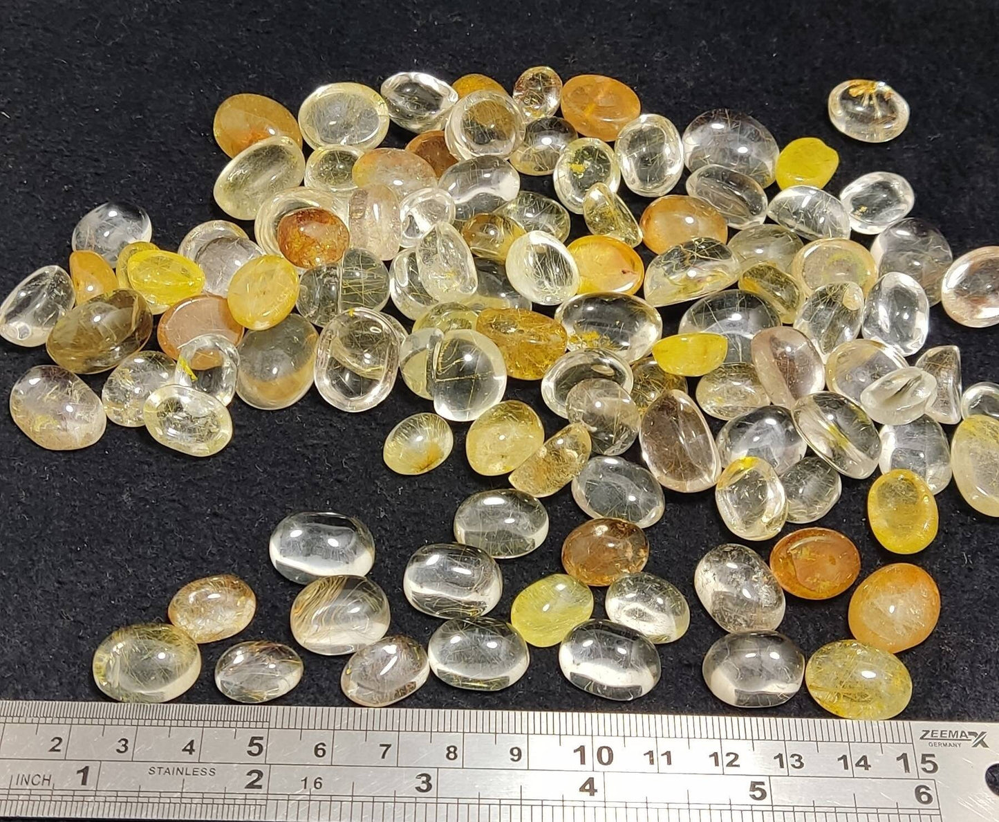 An amazing lot of Rutile included polished quartz Cabochons more than 100 pieces