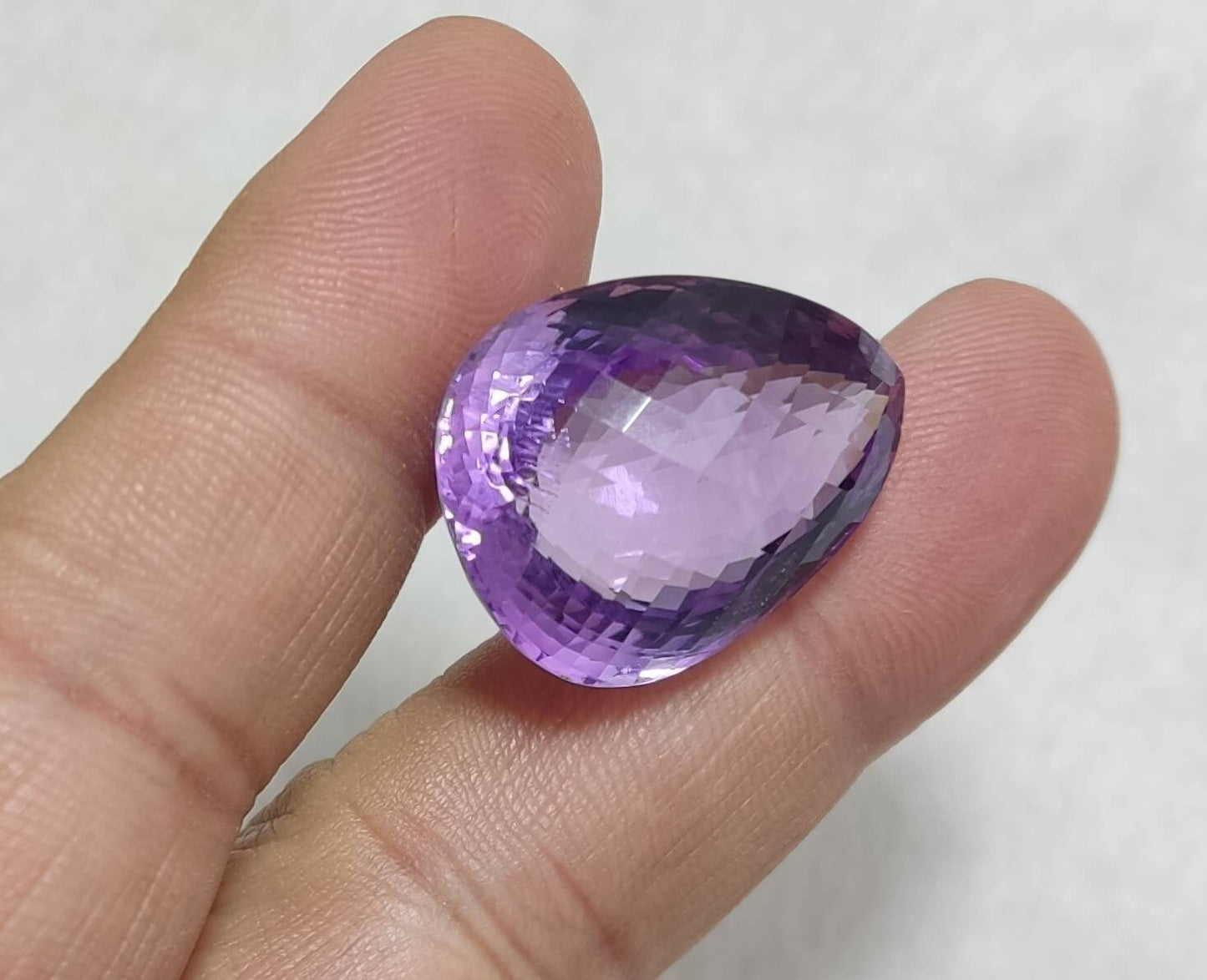 An amazing tear drop cut faceted amethyst gemstone 44 carats