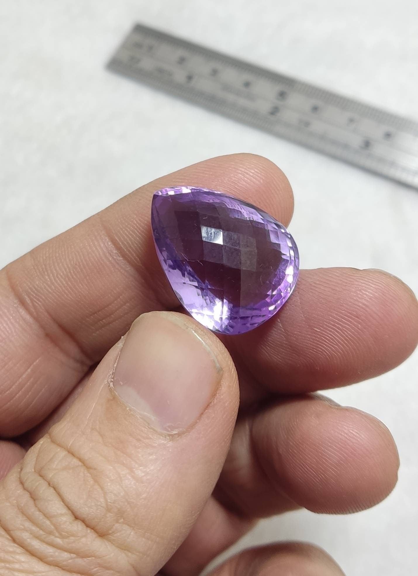 Tear drop cut faceted amethyst gemstone 40 carats