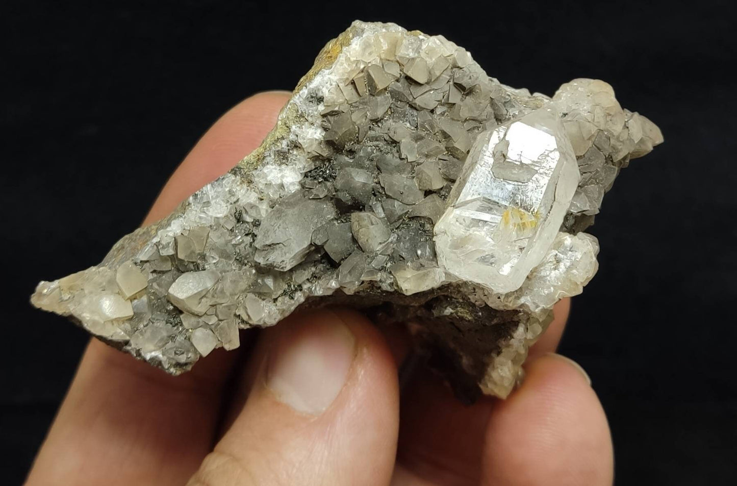 An amazing terminated petroleum included quartz crystal on matrix with calcite 83 grams