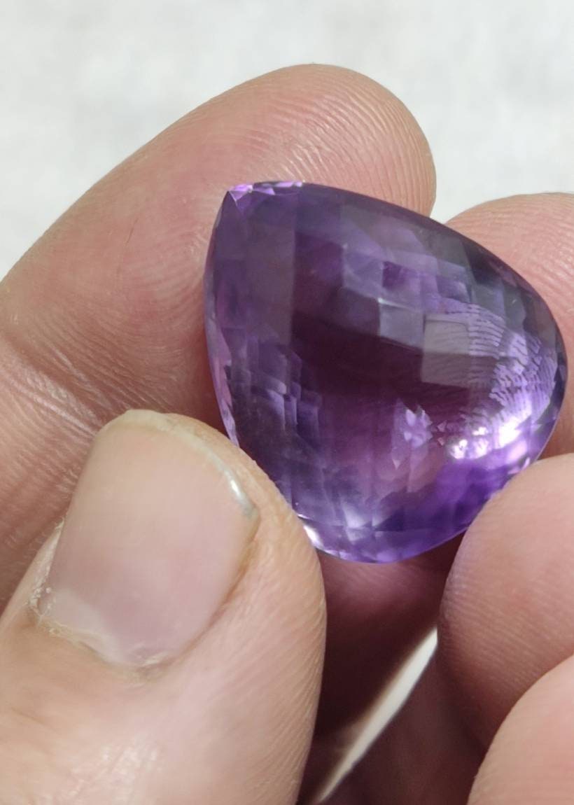 Tear drop cut faceted amethyst gemstone 40 carats