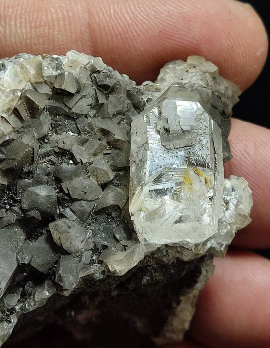 An amazing terminated petroleum included quartz crystal on matrix with calcite 83 grams