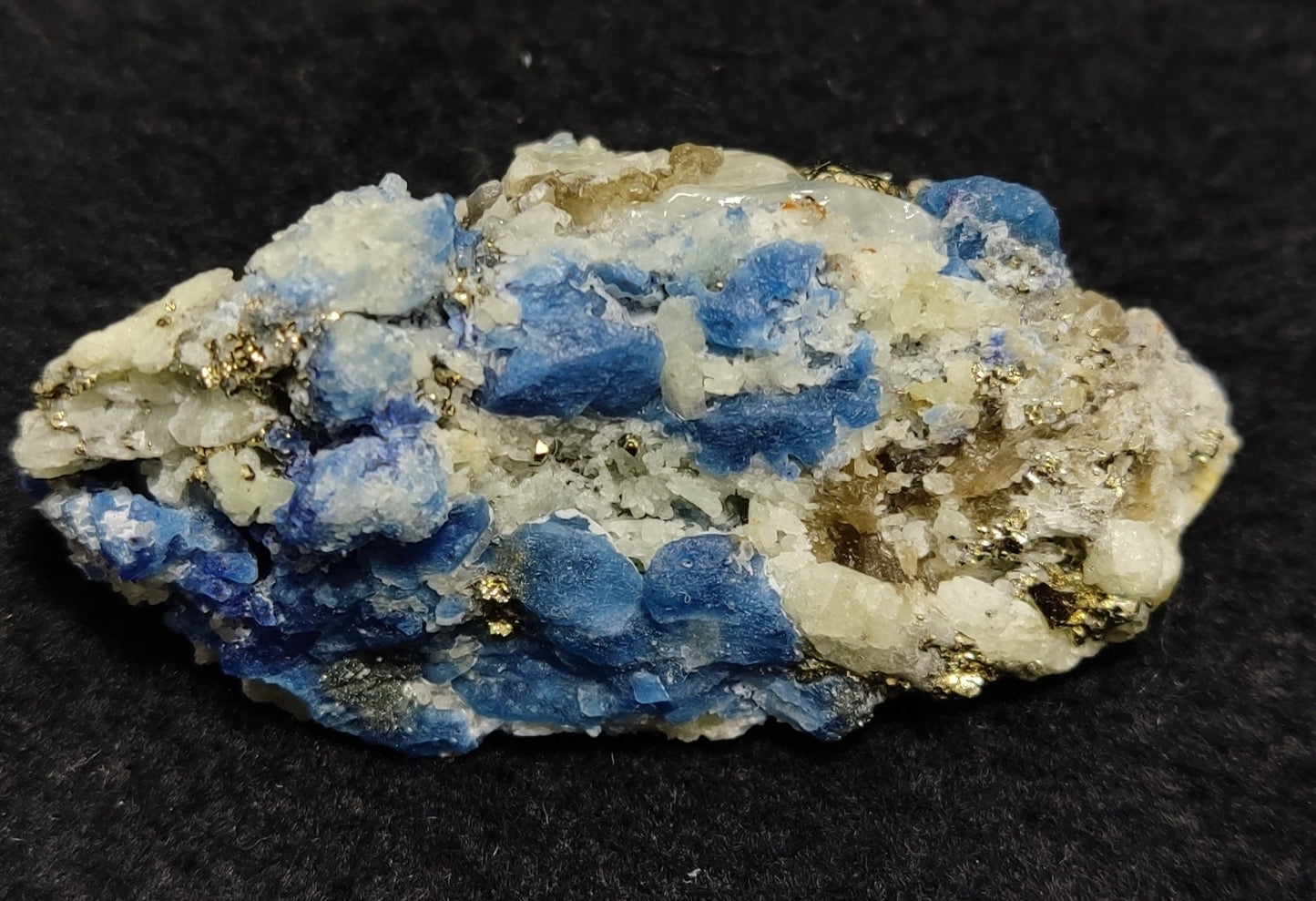 Afghanite Fluorescent in matrix with some pyrite and phlogopite 41 grams