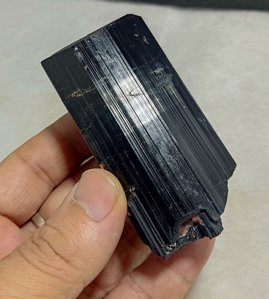 Natural black Tourmaline crystal with spessartine garnet inclusions 245 grams